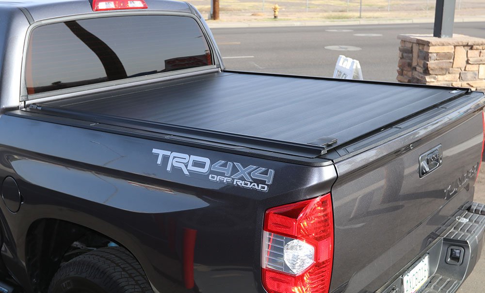 Aosky retractable aluminum tonneau cover open on a truck bed